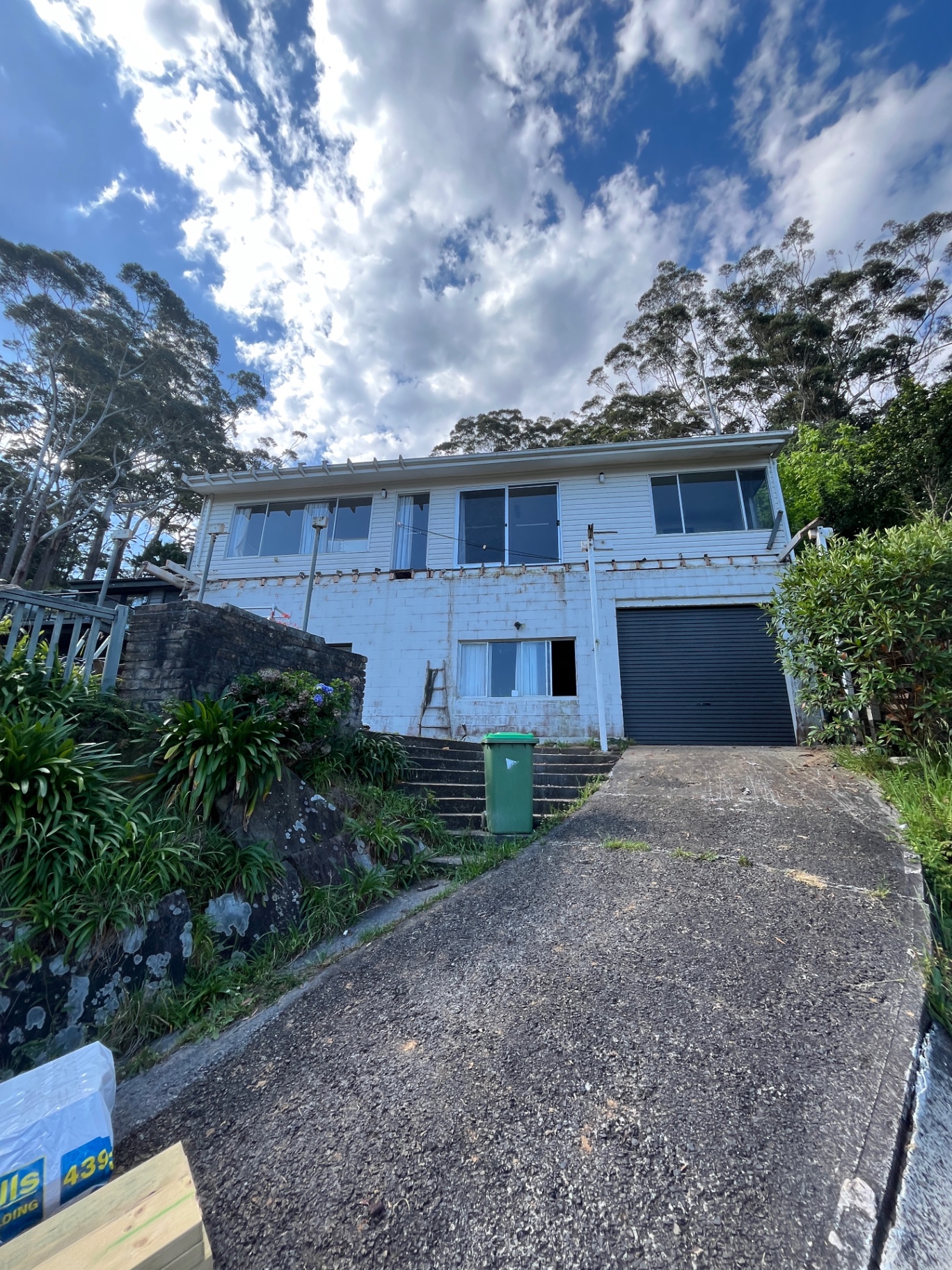 Before: the Wamberal home with its old elevated deck stripped back to bare bearers and blockwork