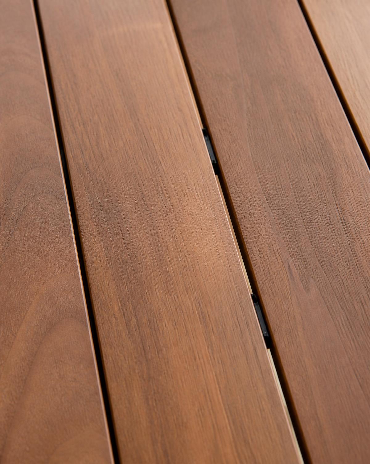 Close detail of hardwood decking boards fixed with concealed clips, showing consistent gapping